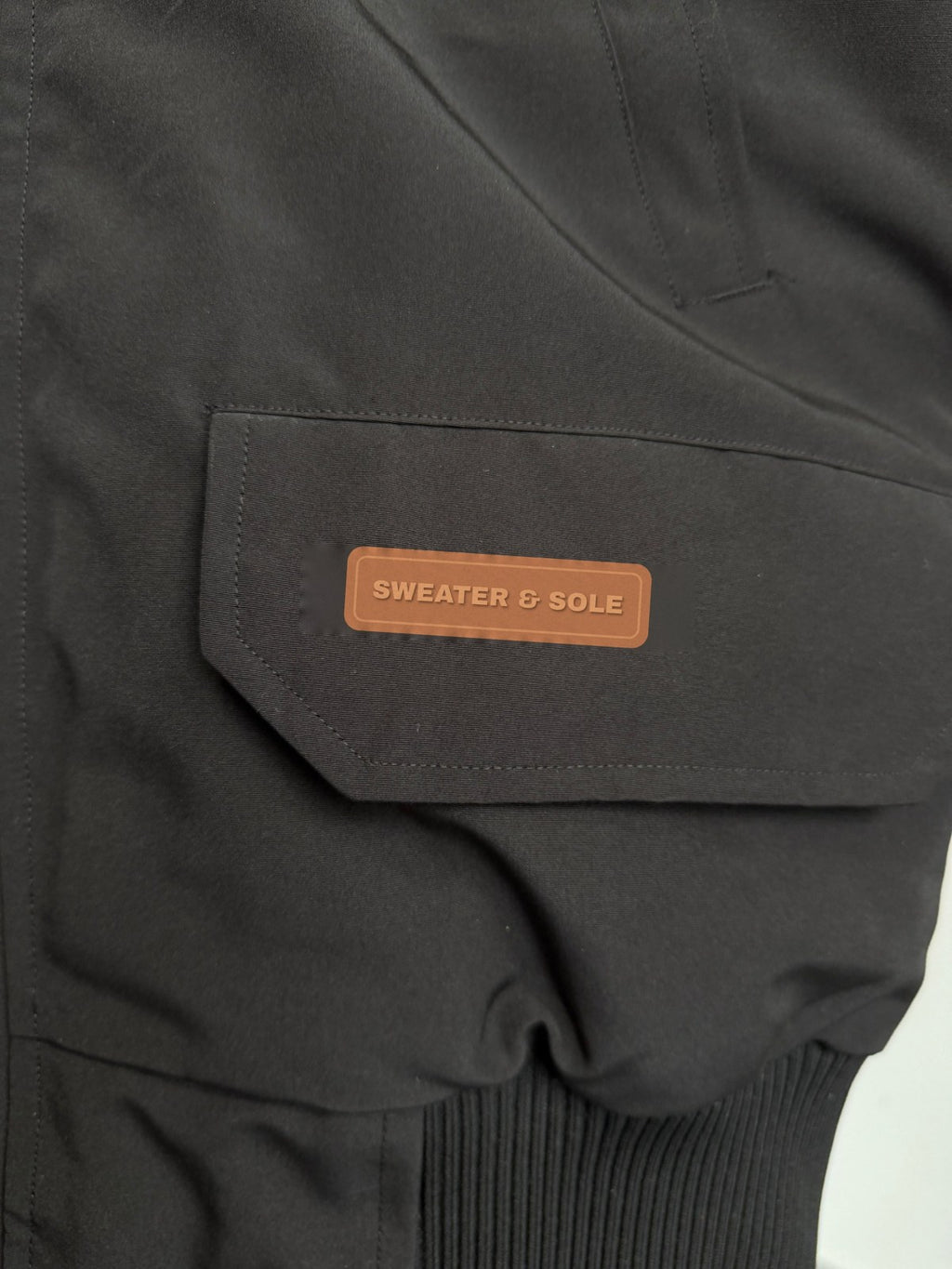 S&S Hooded Parka in Black, copper rubber SWEATER & SOLE pocket label