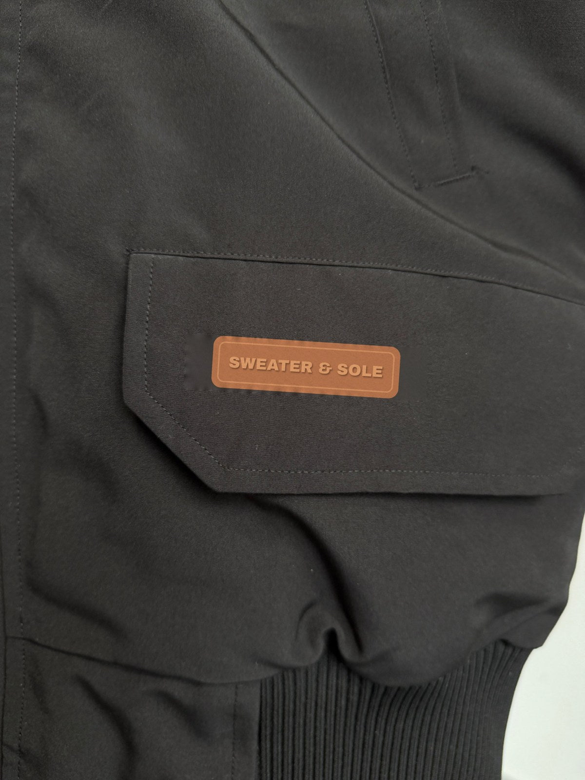 S&S Hooded Parka in Black, copper rubber SWEATER & SOLE pocket label